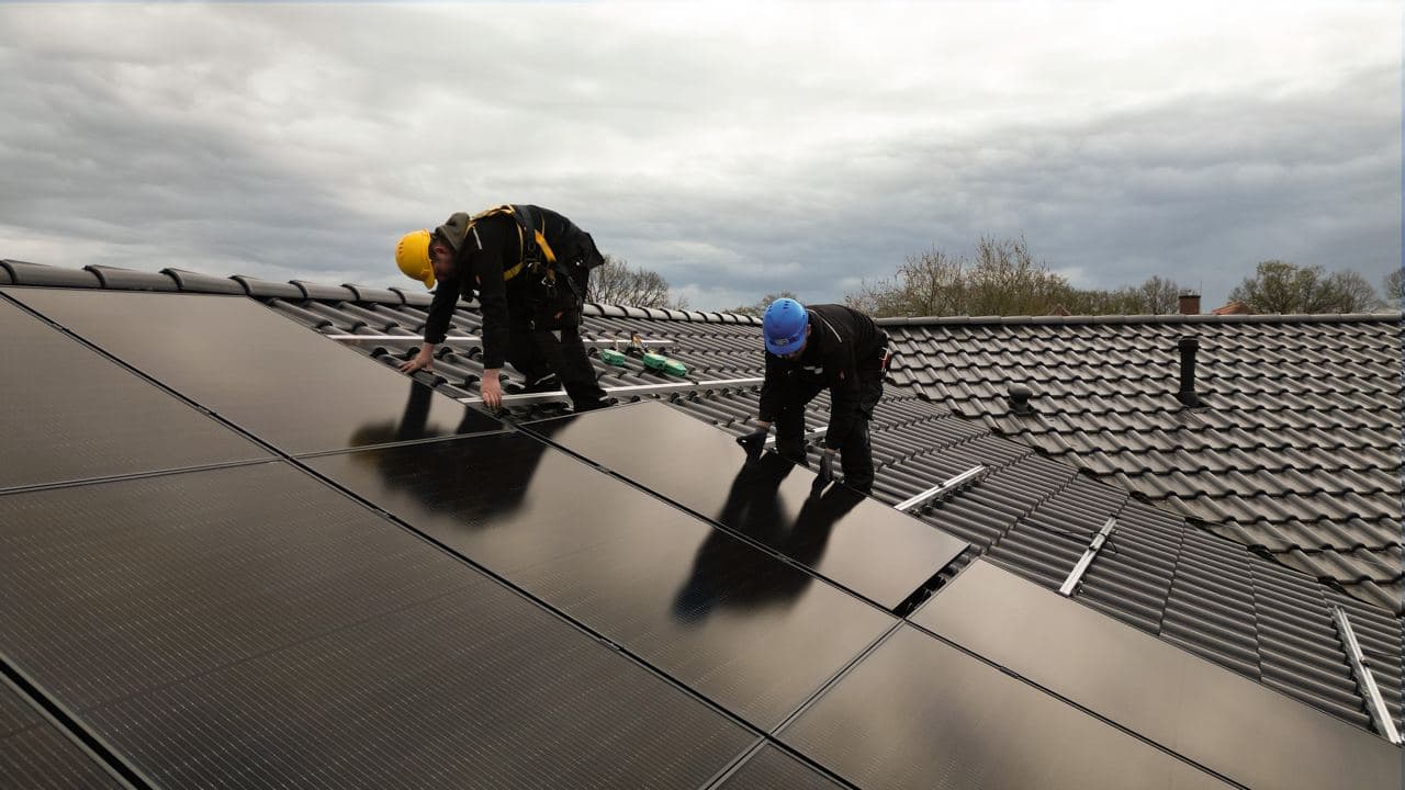 House with solar panels on the roof in the sun